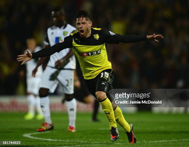 Javier Acuna of Watford celebrates as he scores their first goal during the Capital One Cup Third Round match between Watford and Norwich City at...