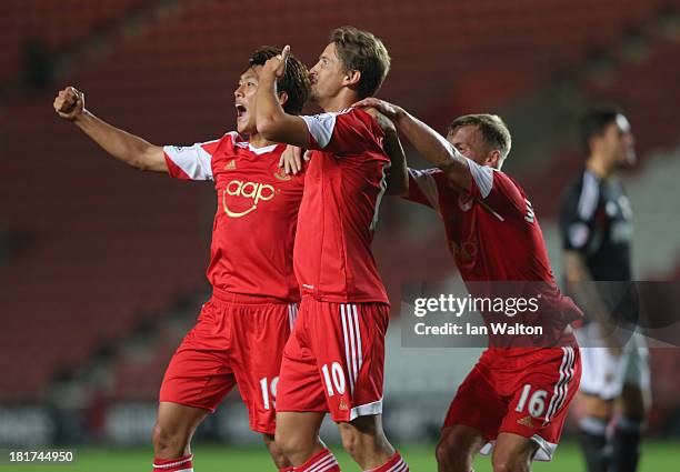 Gaston Ramirez of Southampton celebrates with Tadanari Lee and James Ward-Prowse after scoring the opening goal waith Tadanari Lee during the Capital...