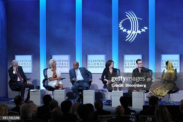 Former U.S. President Bill Clinton, from left, Christine Lagarde, managing director of International Monetary Fund , Mo Ibrahim, founder of Celtel...