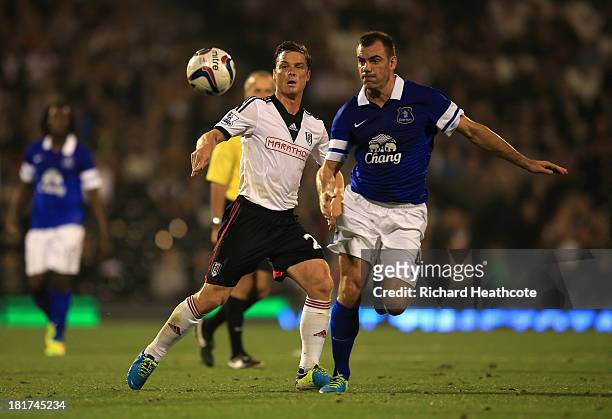 Scott Parker of Fulham challenges Darron Gibson of Everton during the Captial One Cup Third Round match between Fulham and Everton at Craven Cottage...