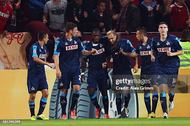 Marcel Risse of Koeln celebrates his team's first goal with team mates during the DFB Cup second round match between 1. FSV Mainz 05 and 1. FC Koeln...