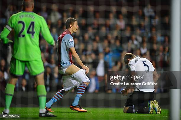 Nicklas Helenius of Aston Villa complains to the referee after having his shorts pulled down by Jan Vertonghen of Tottenham Hotspur during the...