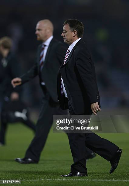 Nottingham Forest manager Billy Davies walks off the pitch with Burnley manager Sean Dyche during the Capital One Cup Third Round match between...