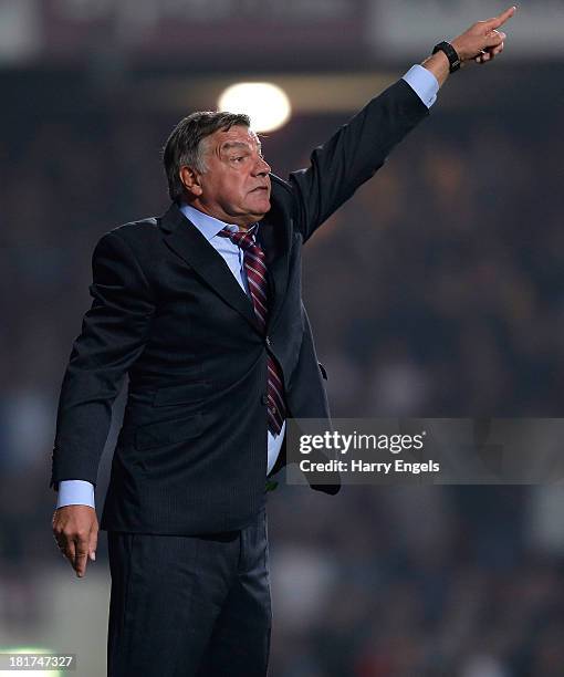 West Ham manager Sam Allardyce gestures during the Capital One Cup third round match between West Ham United and Cardiff City at the Boleyn Ground on...