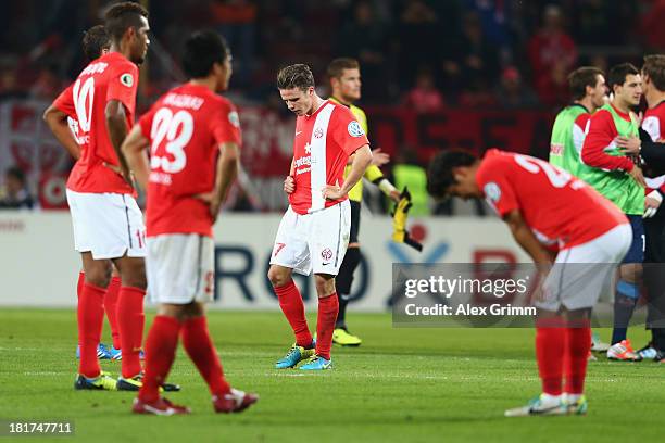 Nicolai Mueller of Mainz and team mates react after the DFB Cup second round match between 1. FSV Mainz 05 and 1. FC Koeln at Coface Arena on...