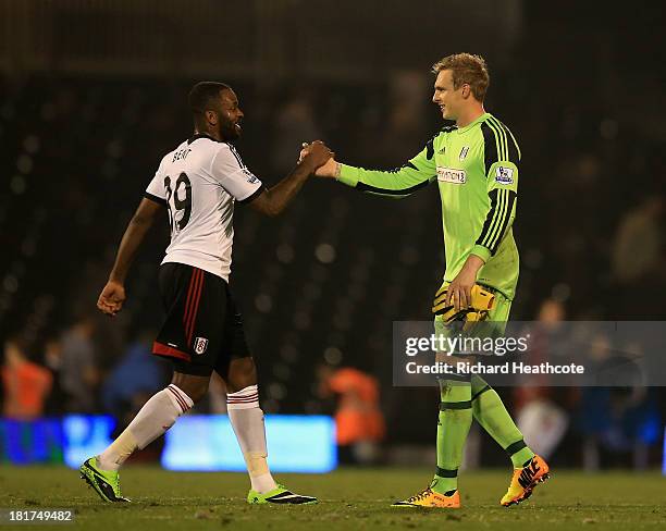 Darren Bent and David Stockdale of Fulham celebrate at the final whistle during the Captial One Cup Third Round match between Fulham and Everton at...