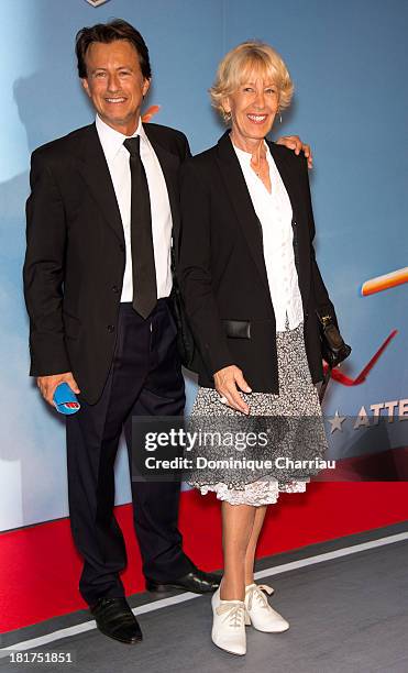 Vincent Perrot and his mother attend the 'Planes' Paris Premiere At UGC Normandie on September 24, 2013 in Paris, France.