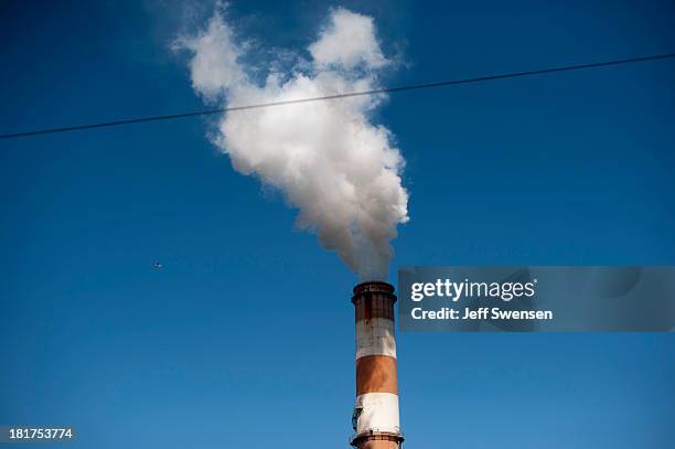 Plume of exhaust extends from the Mitchell Power Station, a coal-fired power plant built along the Monongahela River, 20 miles southwest of...