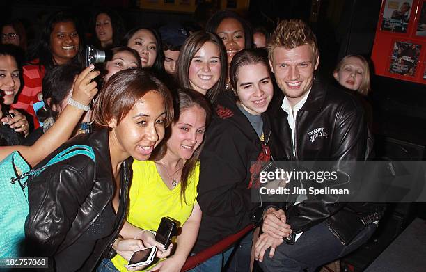 Nick Carter and fans visit at Planet Hollywood Times Square on September 24, 2013 in New York City.