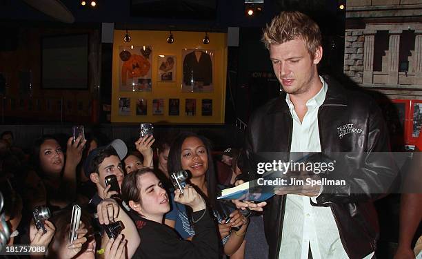 Nick Carter and fans visit at Planet Hollywood Times Square on September 24, 2013 in New York City.