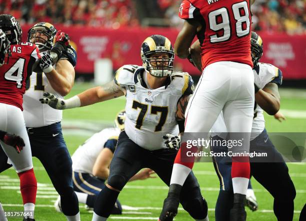 Jake Long of the St. Louis Rams blocks against Cliff Matthews of the Atlanta Falcons at the Georgia Dome on September 15, 2013 in Atlanta, Georgia.