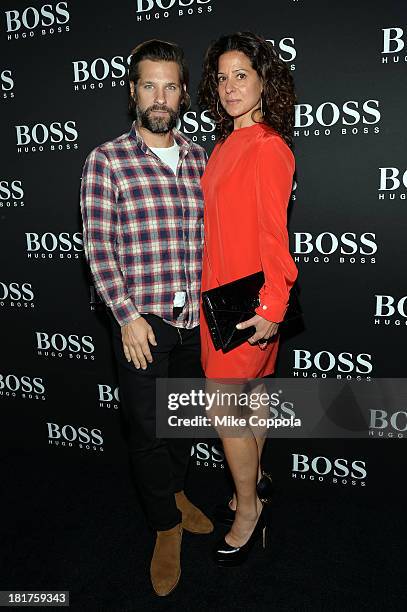 Artist Aaron Young and guest attend HUGO BOSS celebrates Columbus Circle BOSS flagship opening featuring premiere of "Anthropocene," by Marco...