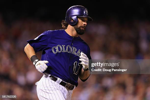 Todd Helton of the Colorado Rockies runs to first as he singles against the Boston Red Sox in the sixth inning at Coors Field on September 24, 2013...