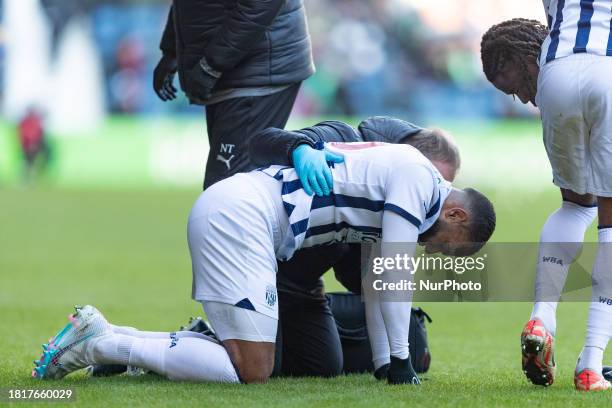 Matt Phillips is receiving treatment after being fouled during the Sky Bet Championship match between West Bromwich Albion and Leicester City at The...