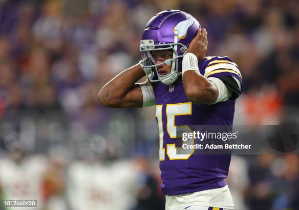 Joshua Dobbs of the Minnesota Vikings listens for a play call during the second quarter against the Chicago Bears at U.S. Bank Stadium on November...