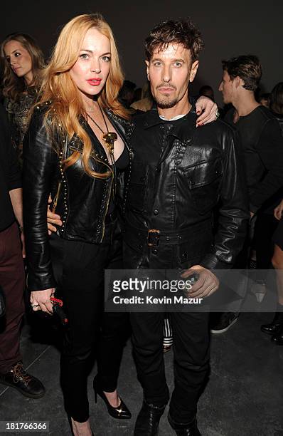 Lindsay Lohan and Steven Klein attend Madonna and Steven Klein secretprojectrevolution at the Gagosian Gallery on September 24, 2013 in New York City.