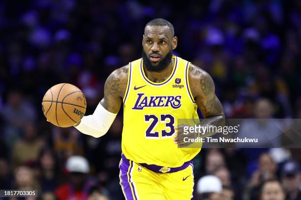 LeBron James of the Los Angeles Lakers dribbles during the third quarter against the Philadelphia 76ers at the Wells Fargo Center on November 27,...