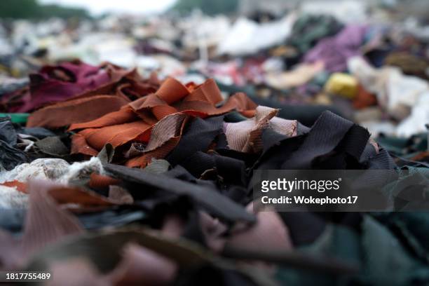 fashion garbage - clothes waste stock-fotos und bilder