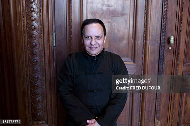 French designer Azzedine Alaia poses during his exhibition at the Palais Galliera, on September 25 in Paris. AFP PHOTO / FRED DUFOUR