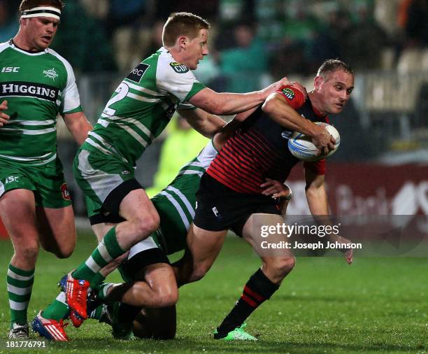 Andy Ellis of Canterbury is tackled by Hamish Northcott and Jade Te Rure of Manawatu during the round 7 ITM Cup match between Canterbury and Manawatu...