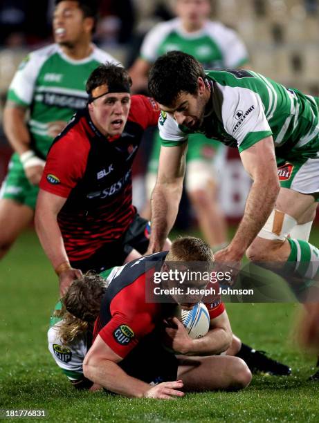 Johnny McNicholl of Canterbury is tackled by James Oliver and Nick Crosswell during the round 7 ITM Cup match between Canterbury and Manawatu at AMI...