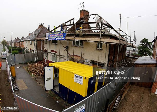 Builders begin to demolish the semi-detached house where six children died in a fire started by their parents Mick and Mairead Philpott at 18 Victory...