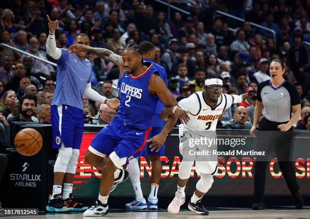 Kawhi Leonard of the LA Clippers steals the ball in front of Reggie Jackson of the Denver Nuggets in the first quarter at Crypto.com Arena on...