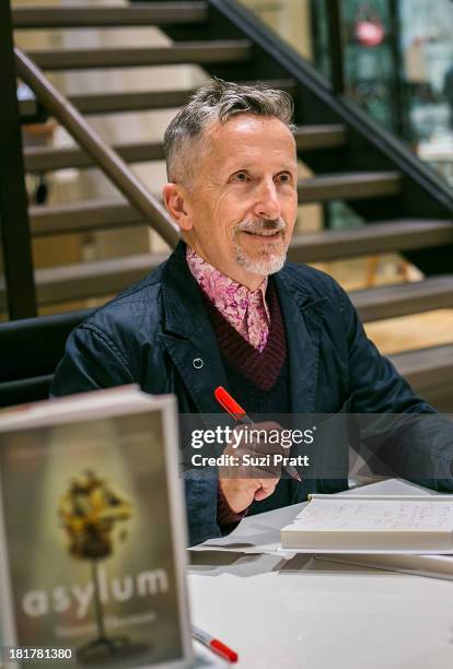 Simon Doonan signs copies of his latest memoir 'The Asylum: A Collage Of Couture Reminiscences...And Hysteria' at Barneys New York on September 24,...