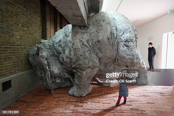 Helmi, aged 2, admires a clay sculpture of an elephant in the exhibition 'Today We Reboot the Planet' by Adrian Villar Rojas in the redeveloped...