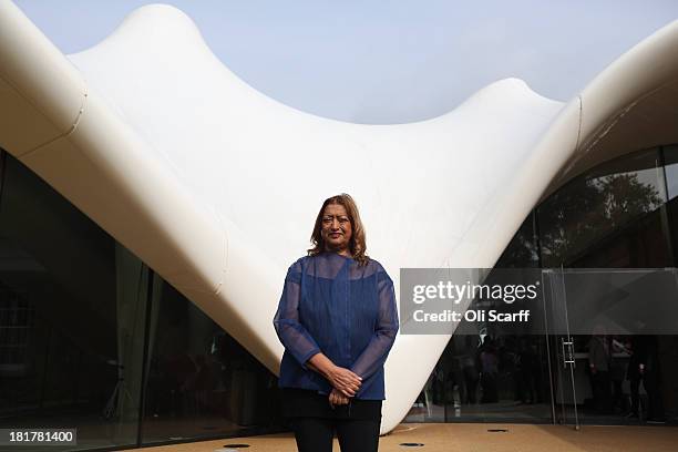 Architect Zaha Hadid poses for a photograph in front of the redeveloped Serpentine Sackler Gallery in Hyde Park on September 25 2013 in London,...