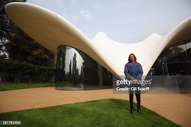 Architect Zaha Hadid poses for a photograph in front of the redeveloped Serpentine Sackler Gallery in Hyde Park on September 25 2013 in London,...