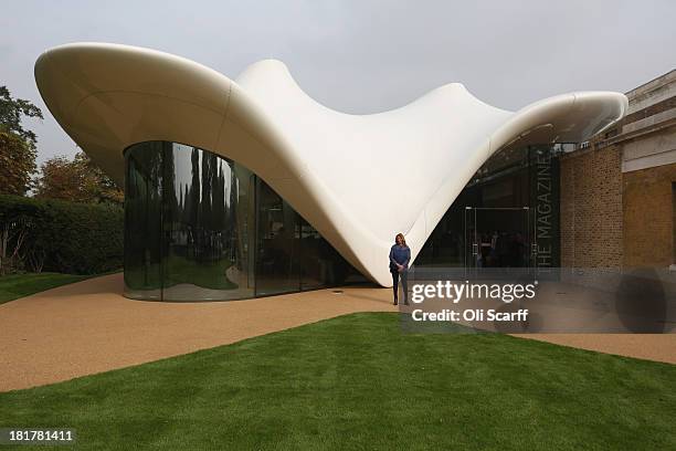 Architect Zaha Hadid poses for a photograph in front of the redeveloped Serpentine Sackler Gallery in Hyde Park on September 25 2013 in London,...