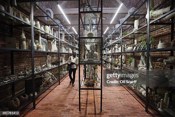 Members of the public admire the exhibition 'Today We Reboot the Planet' by Adrian Villar Rojas in the redeveloped Serpentine Sackler Gallery in Hyde...