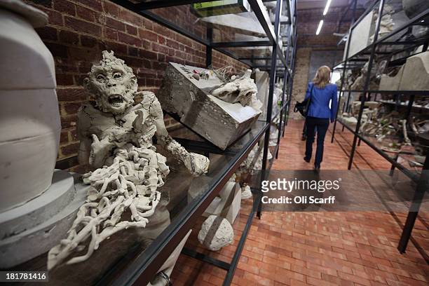 Members of the public admire the exhibition 'Today We Reboot the Planet' by Adrian Villar Rojas in the redeveloped Serpentine Sackler Gallery in Hyde...