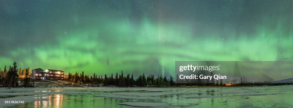 Aurora over a lakeside hotel near Denali Panorama