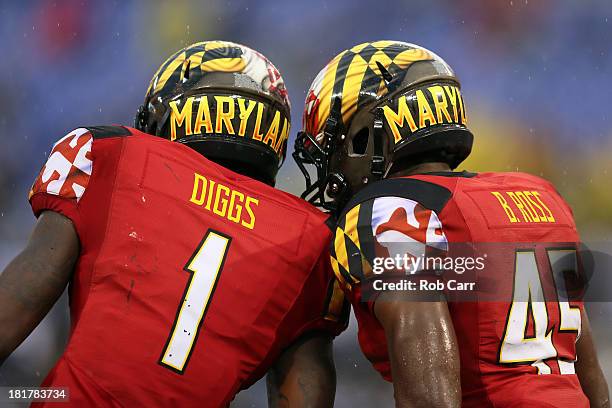 Stefon Diggs and Brandon Ross of the Maryland Terrapins celebrate after Ross rushed for a touchdown against the West Virginia Mountaineers at M&T...