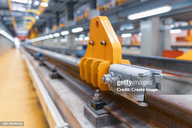 stopper in railroad track in railway workshop for engineering industry or transportation concept. - train tracks end stock pictures, royalty-free photos & images