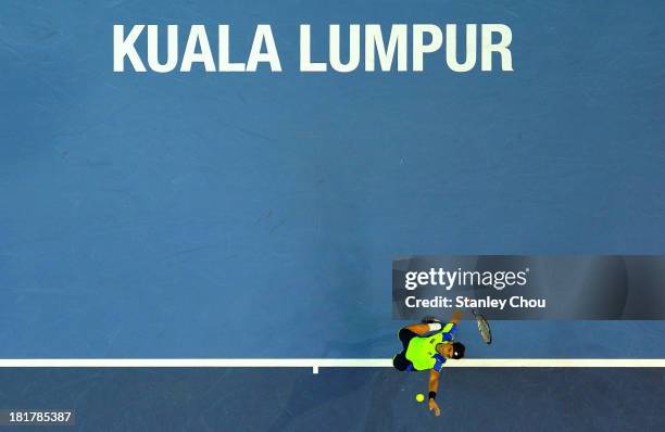 David Ferrer of Spain serves against Matteo Viola of Italy during day three of the 2013 Malaysian Open at Putra Stadium on September 25, 2013 in...