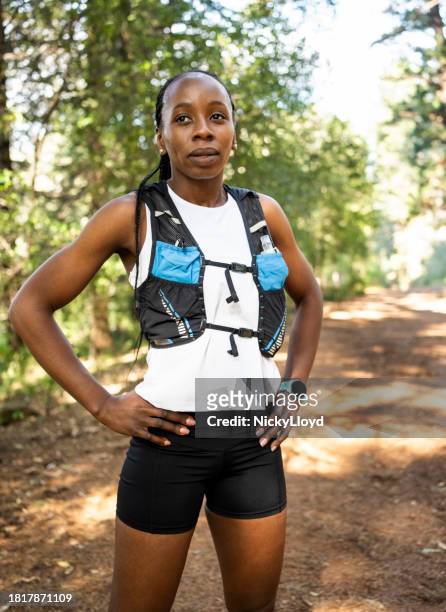 woman cross country runner taking break after training session in forest - south africa training session stock pictures, royalty-free photos & images
