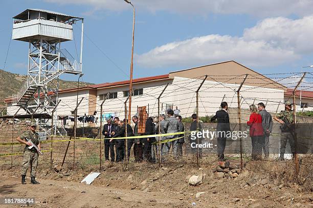 Turkish police and gendarmerie look for evidence on September 25, 2013 at the entrance of a tunnel at Bingol M Type Prison in Bingol after 18 inmates...