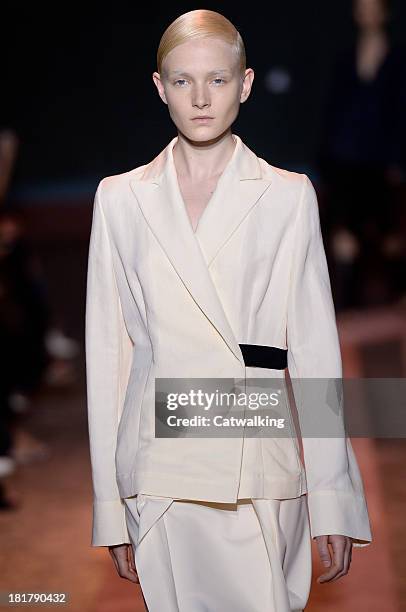 Model walks the runway at the Cedric Charlier Spring Summer 2014 fashion show during Paris Fashion Week on September 24, 2013 in Paris, France.