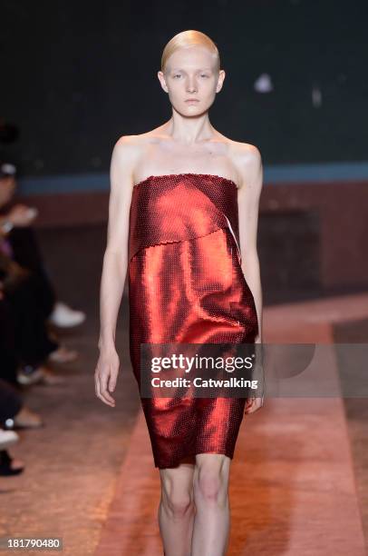 Model walks the runway at the Cedric Charlier Spring Summer 2014 fashion show during Paris Fashion Week on September 24, 2013 in Paris, France.