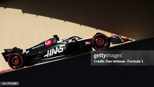 Oliver Bearman of Great Britain driving the Haas F1 VF-23 Ferrari in the Pitlane during Formula 1 testing at Yas Marina Circuit on November 28, 2023...