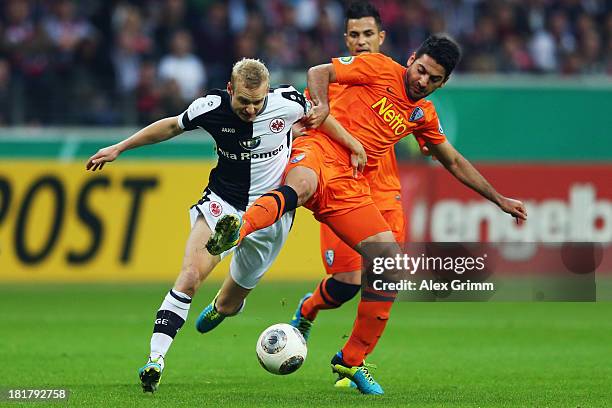 Sebastian Rode of Frankfurt is challenged by Mirkan Aydin of Bochumduring the DFB Cup second round match between Eintracht Frankfurt and VfL Bochum...
