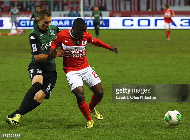 Waris Majeed of FC Spartak Moscow is challenged by Artur Jedrzejczyk of FC Krasnodar during the Russian Premier League match between FC Spartak...