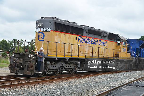 Florida East Coast Railway conductor guides a locomotive during a yard movement in Jacksonville, Florida, U.S., on Monday, Sept. 23, 2013. The FEC is...