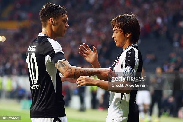 Takashi Inui of Frankfurt celebrates his team's first goal with team mate Vaclav Kadlec during the DFB Cup second round match between Eintracht...