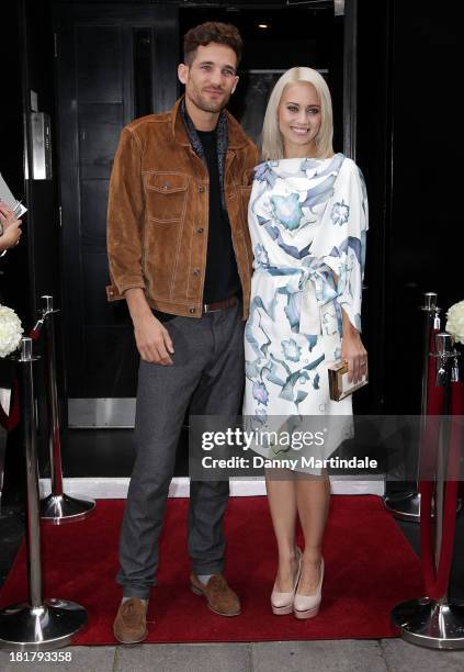 Kimberly Wyatt and model Max Rogers attends a photocall to launch the KEY Fashion brand at Vanilla on September 25, 2013 in London, England.