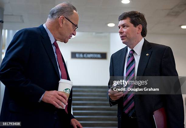 Sept 25: Sen. Charles Schumer, D-NY., and Sen. Mark Begich, D-AK., talk as they pass in the senate subway of the U.S. Capitol on September 25, 2013.
