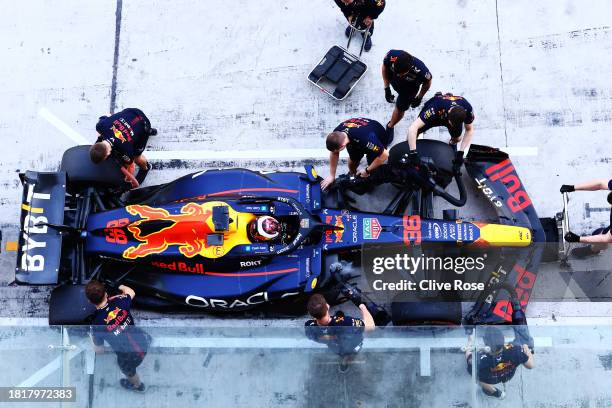 Jake Dennis of Great Britain driving the Oracle Red Bull Racing RB19 stops in the Pitlane during Formula 1 testing at Yas Marina Circuit on November...